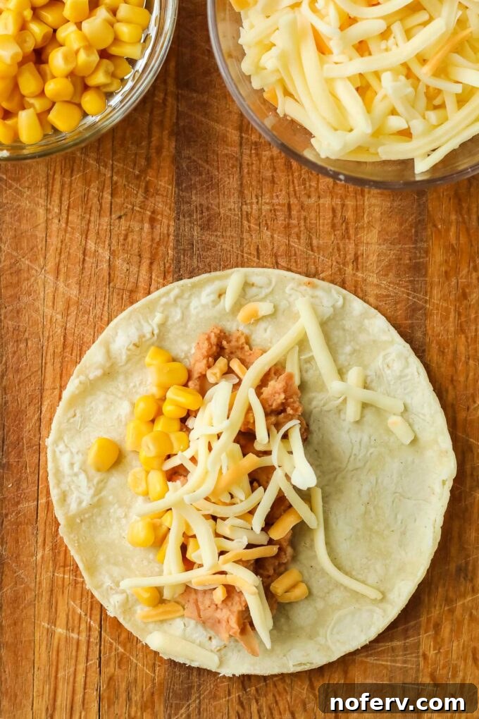 Step 2: Adding filling, corn, and cheese to tortilla