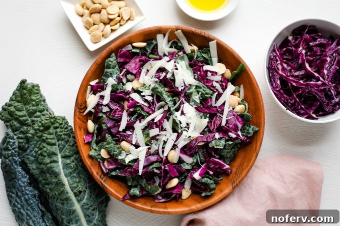 4 Reasons Why You've Misjudged Kale 6 A vibrant Lacinato kale salad in a stylish bowl, topped with shredded cheese and a light dressing.