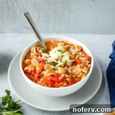 A close-up shot of the finished chickpea and farro soup in a serving bowl.