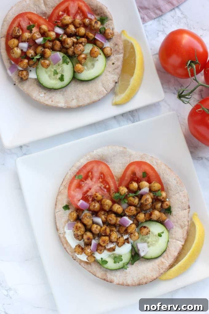 Freshly assembled chickpea gyros with generous fillings and homemade tzatziki.