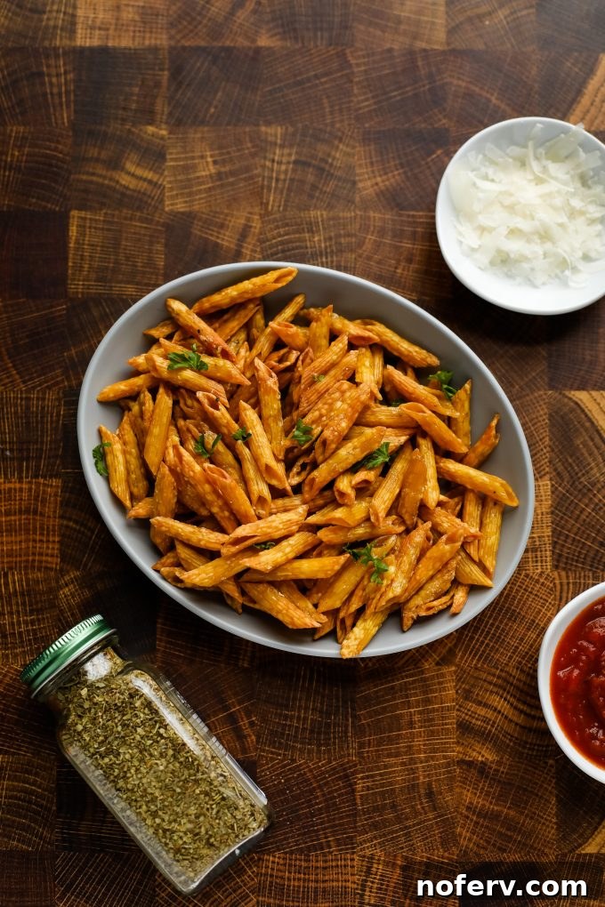 Freshly made pasta chips from an air fryer, perfectly golden and crispy.