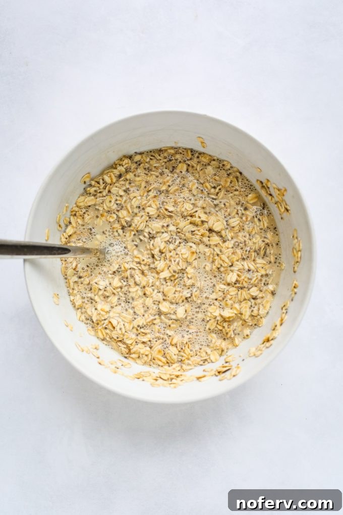 Dry ingredients for baked oatmeal in a bowl, ready to be mixed.