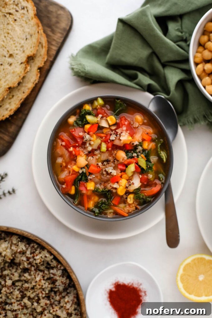Vibrant Vegetarian Quinoa Dishes 2 A vibrant tri-color quinoa soup, rich with vegetables, served in a rustic bowl.