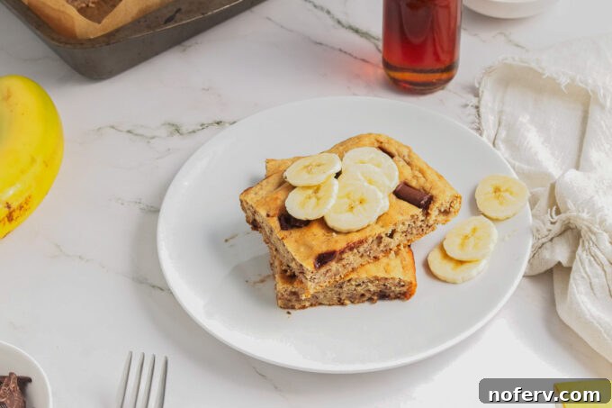 Overhead view of vegan sheet pan pancakes cut into squares, ready for serving.