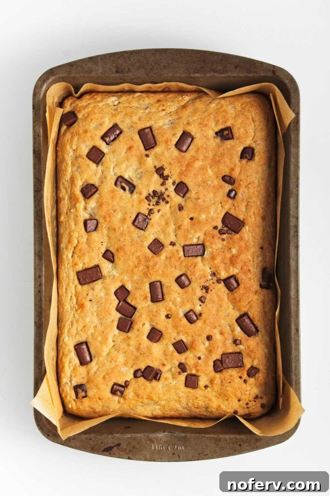 Baked vegan sheet pan pancakes, golden and fluffy, ready to be served.