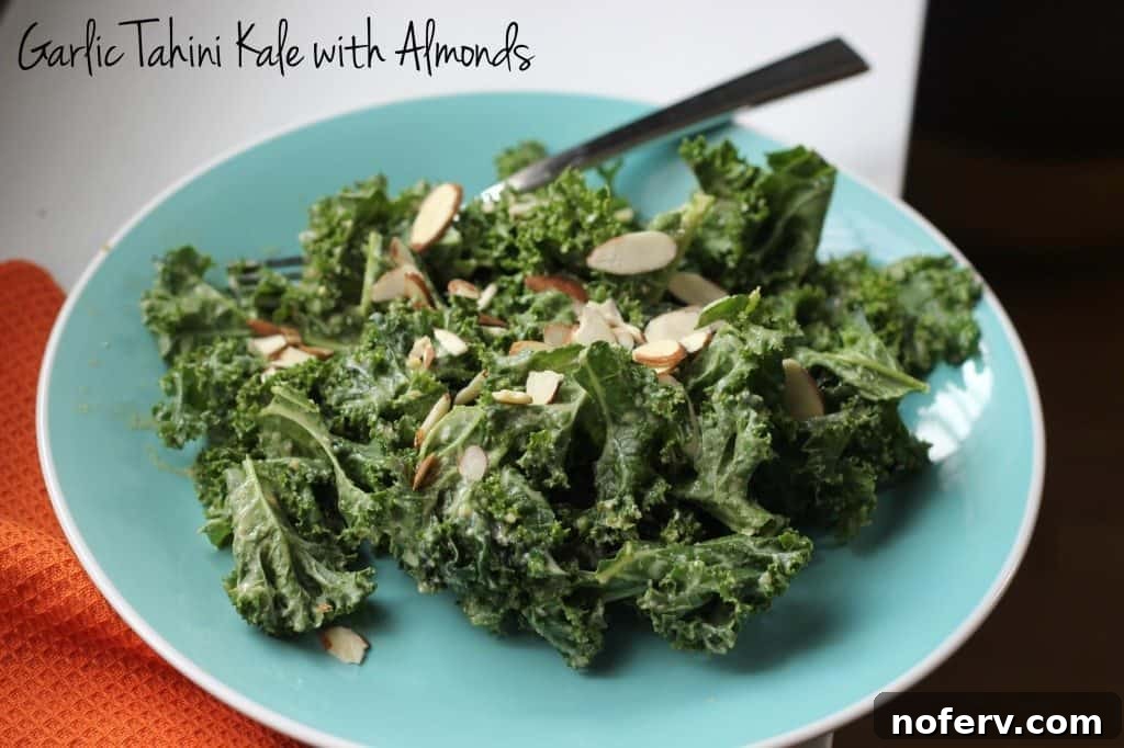 Colorful and nutritious kale salad topped with crunchy almonds for lunch