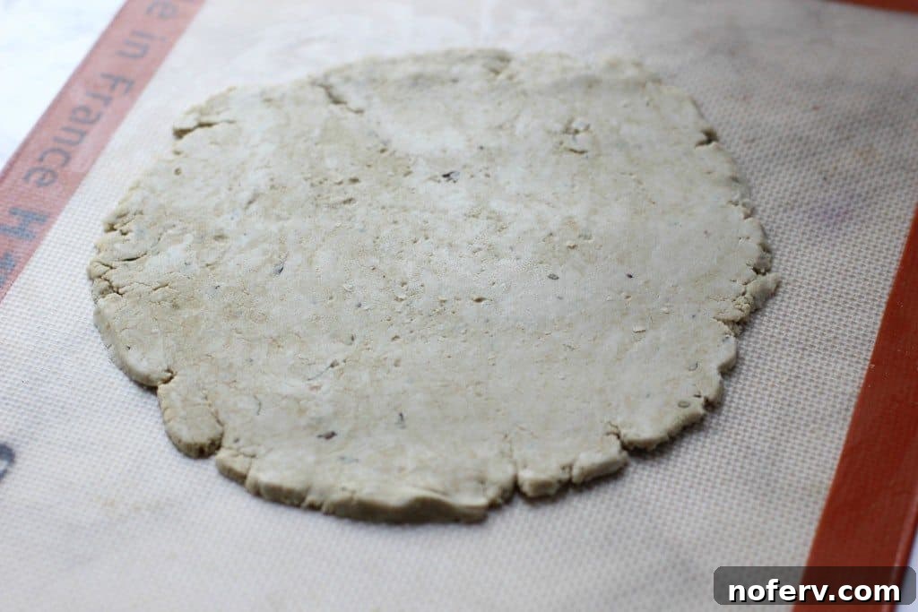 Green Goddess Quinoa Pizza 3 Close-up of a freshly baked Pesto Quinoa Pizza slice, showcasing the crispy crust and melted cheese.