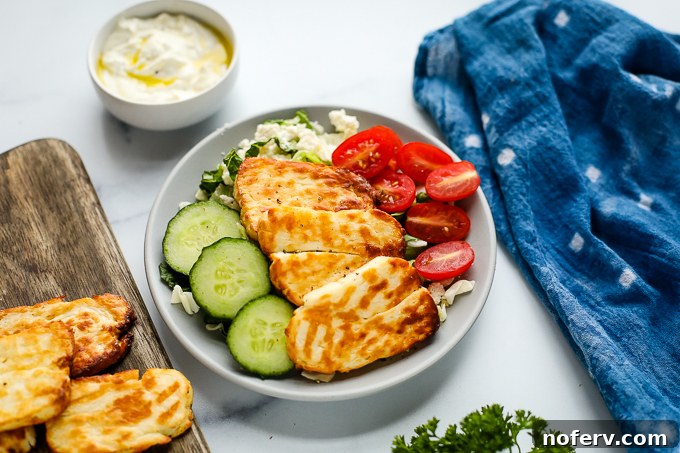 Perfectly cooked, crispy Air Fryer Halloumi slices, ready to be added to salads or sandwiches.