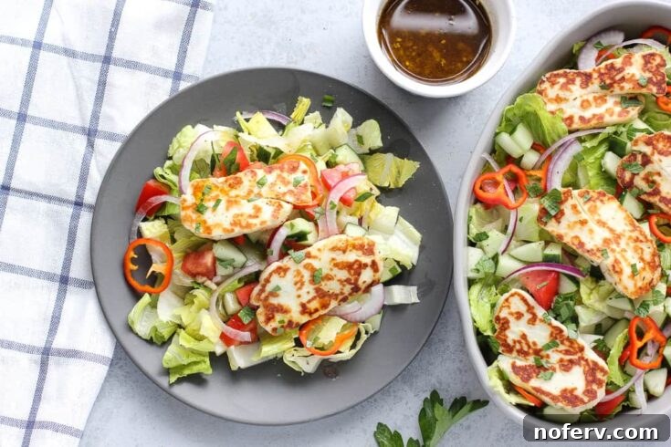 A refreshing Easy Halloumi Salad featuring cold, crunchy vegetables and crispy halloumi.