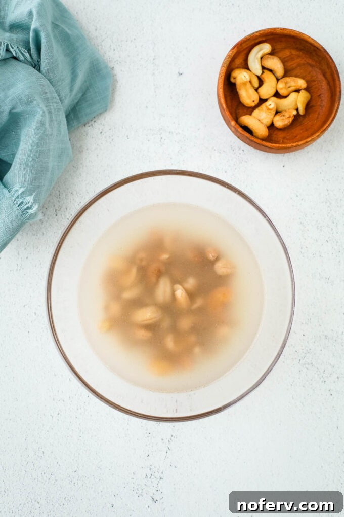 Soaked raw cashews in a bowl after draining