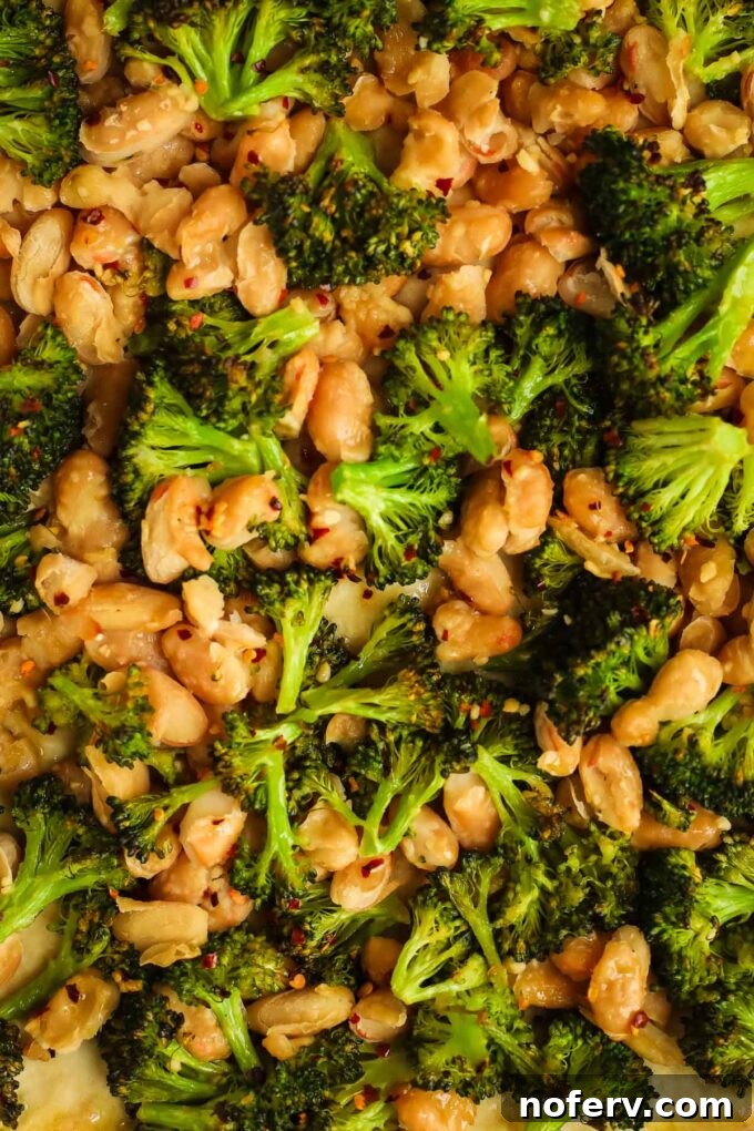 Vibrant Vegan Broccoli Pizza 4 Pizza dough being rolled out on a floured surface with a rolling pin