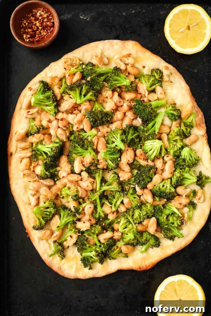 Vibrant Vegan Broccoli Pizza 9 Baked vegan broccoli pizza with a perfectly golden brown crust, fresh out of the oven