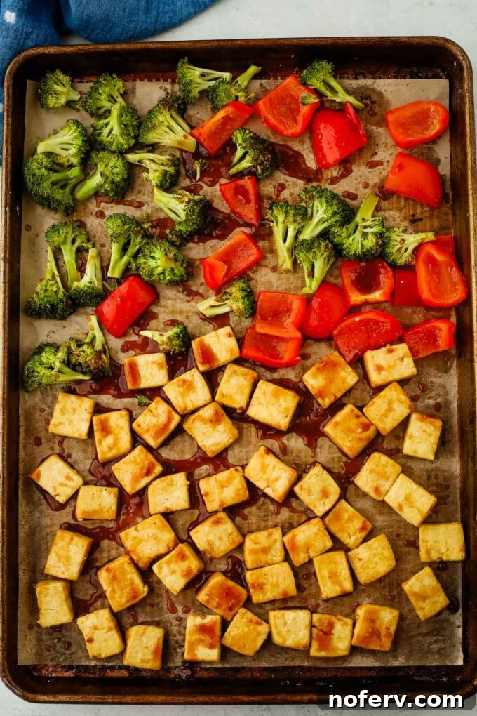 Effortless Sheet Pan Teriyaki Tofu 6 Teriyaki tofu tossed with sauce on a baking sheet