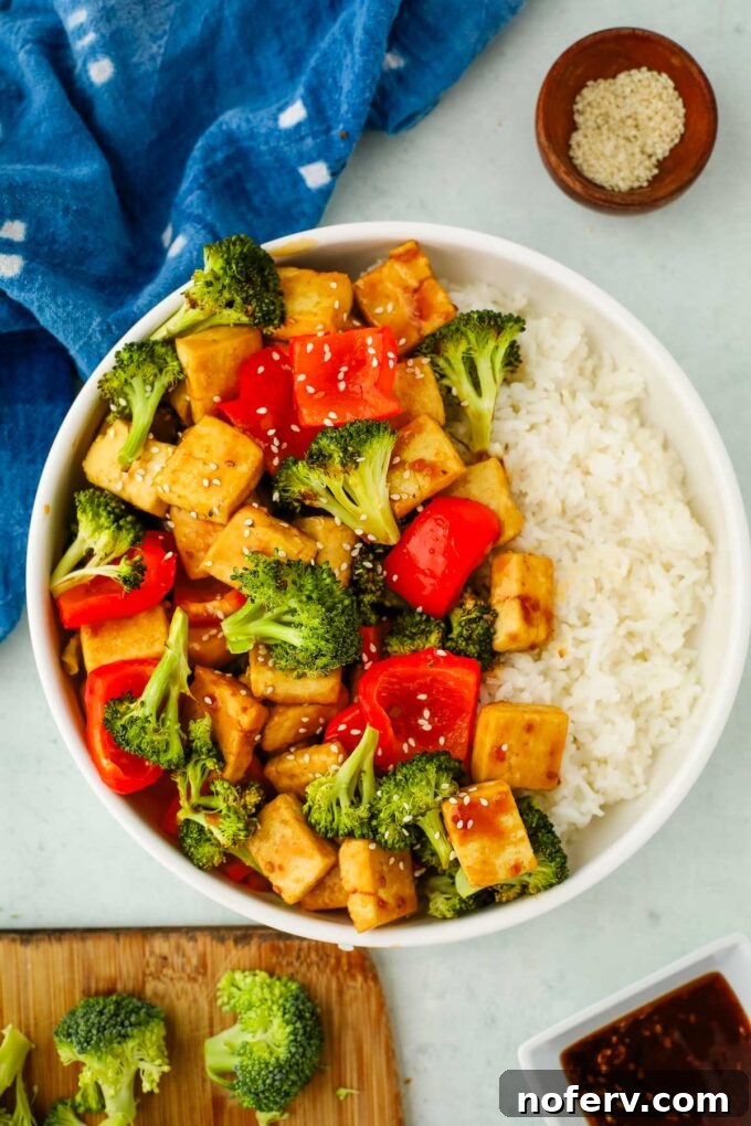 Effortless Sheet Pan Teriyaki Tofu 7 Close up of teriyaki tofu with rice and sesame seeds