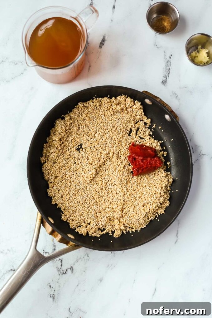 Savory Quinoa Taco Filling 3 Sautéing quinoa, olive oil, and tomato paste in a skillet.