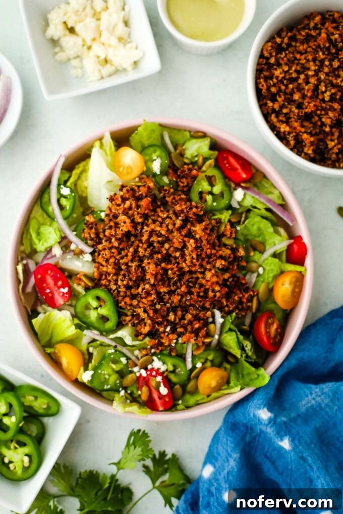 Savory Quinoa Taco Filling 10 A vibrant quinoa taco bowl with corn, avocado, and lime.