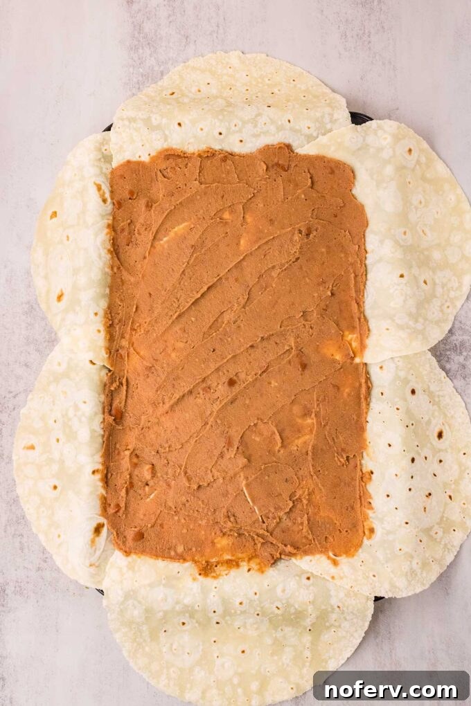 Loaded Vegetarian Crunchwrap Recipe: Quick Meatless Taco Wraps 5 Spread refried beans