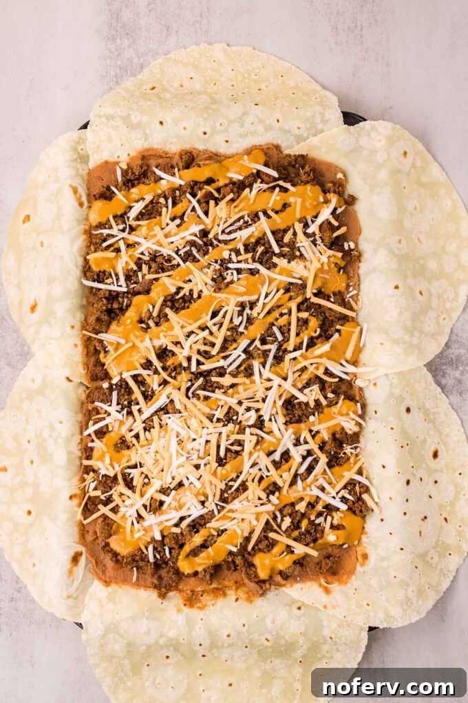 Loaded Vegetarian Crunchwrap Recipe: Quick Meatless Taco Wraps 7 Drizzle queso and cheese