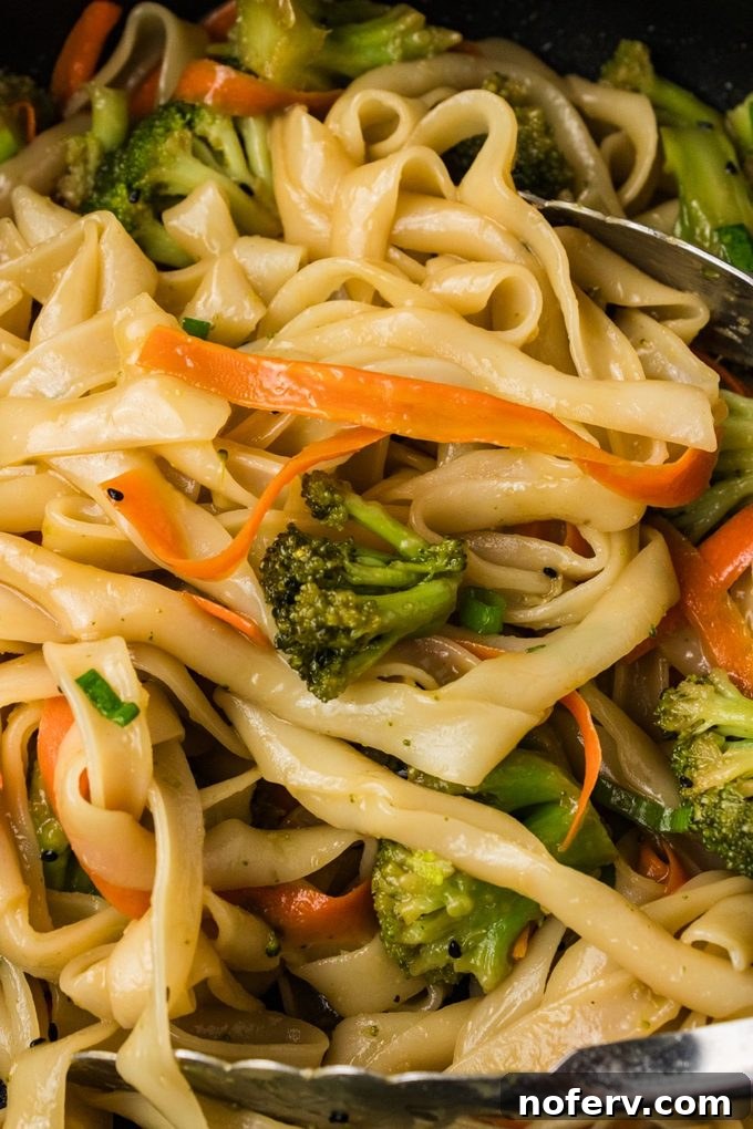 Sweet-Savory Teriyaki Rice Noodles with Veggies 2 Noodles in a pan with teriyaki sauce