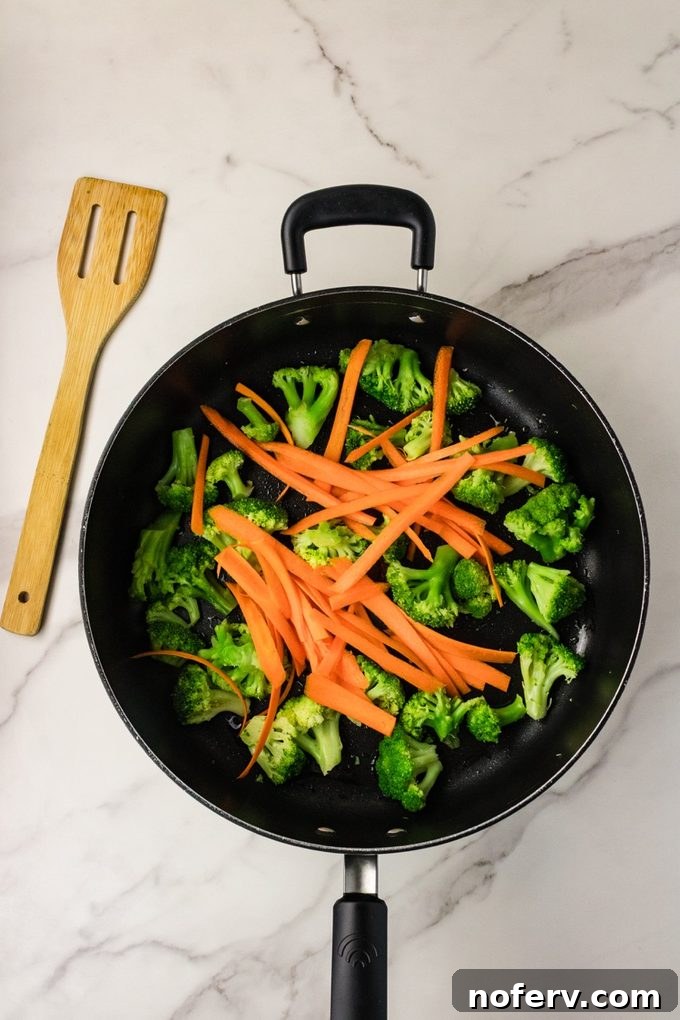 Sweet-Savory Teriyaki Rice Noodles with Veggies 6 Carrot ribbons added to skillet